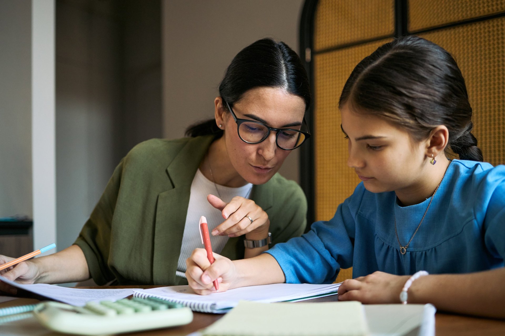 Tutor helping child at home